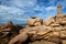 Ploumanac`h Mean Ruz lighthouse between the rocks in pink granite coast, Perros Guirec, Brittany, France.