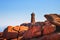 Ploumanach lighthouse sunrise in pink granite coast, Brittany, F