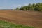 Plowed agricultural field prepared for planting crops in Siberia, Russia