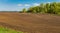 Plowed agricultural field prepared for planting crops in Siberia, Russia