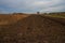 Plowed field in autum at dusk.