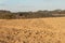 Plowed field in the countryside in Czech Republic. The spring works in the field. Farmland.