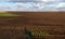 plowed fields, gardens in the evening light