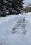 Plowed footpath through the deep snow