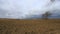 Plowed land in Aude with moving clouds , France