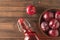 Plum alcoholic drink and plum berries on the table. Flat lay.