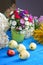 Plum, apples and flowers on a wooden table