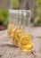 Plum brandy in shot glasses on wooden table