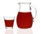 Plum juice in a glass and carafe