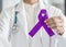 Plum purple ribbon for raising awareness on Alzheimer`s disease, breastfeeding, eating disorder, national family caregivers month