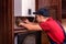 Plumber adjusts gas boiler before operating