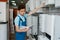 Plumber choosing boiler in plumbering store