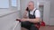 Plumber cleaning radiator and talking on phone
