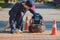 Plumber diagnoses a drain well on the street using special equipment