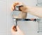 Plumber hands fixing shower mixer