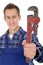 Plumber holding pipe wrench