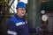 Plumber inspects piping for heat installation;The mechanic - the repairman tightens bolts on a flanged connection of pipeline