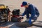 Plumber prepares to fix the problem in the sewer with portable camera for pipe inspection and other plumbing work