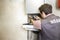 Plumber repairing a condensing boiler