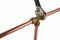 Plumber`s adjustable wremch tightening up copper pipework