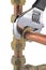 Plumber`s wrench tightening up copper 15mm pipework