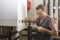 Plumber who carries out the maintenance of a condensing boiler