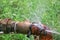 Plumbing main tube and water leak, old tap pipe steel rust on grass floor