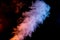 Plume of Red and Blue Smoke isolated on Black Background