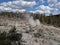 Plume of steam rising from rocks at Yellowstone National Park