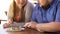 Plump couple eating fresh salad from one plate, weight loss, calories control