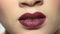 Plump female lips close up.