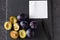 Plums, whole and slices with blank paper - add own text