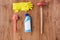 Plunger with cleaning stuff on wooden background