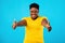 Plus-Size Black Woman Gesturing Thumbs-Up With Both Hands, Blue Background