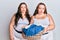 Plus size caucasian sisters woman holding laundry basket depressed and worry for distress, crying angry and afraid