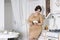 Plus size fashion model on kitchen, fat woman on luxury interior, overweight female body