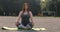 Plus size girl meditating outdoors yoga