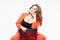 Plus size model with big breast and deep decollete, fat woman on white background in orange pantsuit, body positive concept