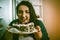 Plus Size Model Smiles Holding Plate With Chocolate Cake