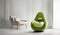 Plush green chair in the shape of an avacado. Minimalist design. Modern room interior