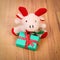 Plush reindeer with gift for Christmas or other celebration