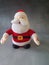 Plush Santa Claus  on gray background, decor item,front view