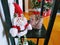 Plush santa on a shelf with festive tree