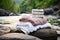 plush towels and bath-essentials near an outdoor hot spring