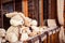 Plush toys: hare, teddy bears are sitting on the windowsill at t