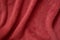Plush wavy red texture. Macro photo. Fabric background