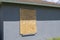 Plywood storm shutters for hurricane protection of house windows. Protective measures before natural disaster in Florida