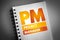 PM - Project Manager acronym on notepad, business concept background