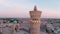 Po-i-Kalyan mosque complex in Bukhara and Kalyan Minaret at sunset, drone aerial