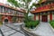 Po Lin Monastery courtyard - Administration office and Guest Hall building, Lantau Island, Hong Kong. Big Buddha statue at Ngong